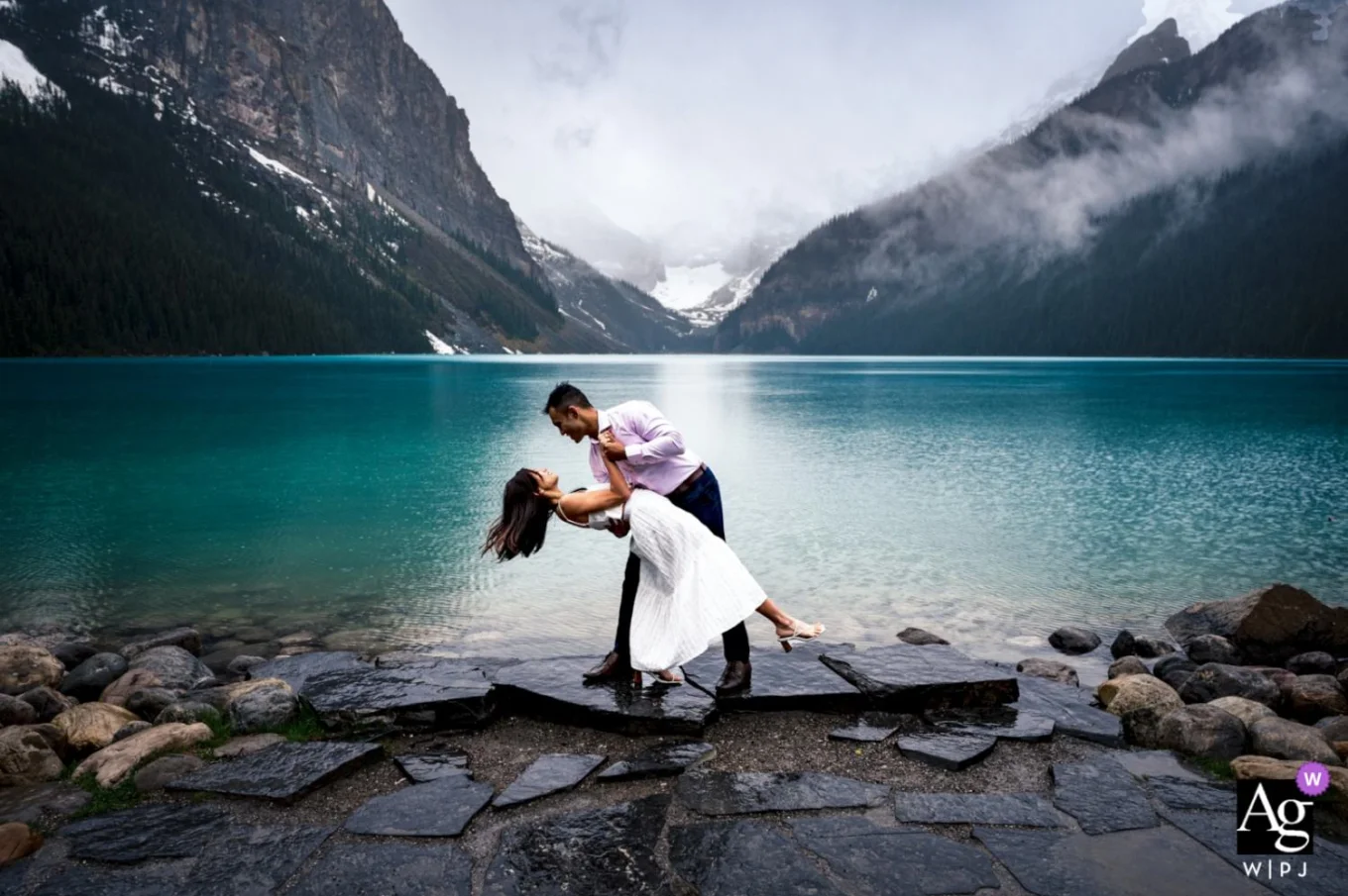 Newlyweds dancing at Lake Louse in Canada