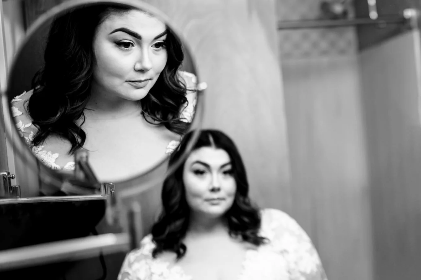 bride's reflection in two mirrors before Banff Wedding