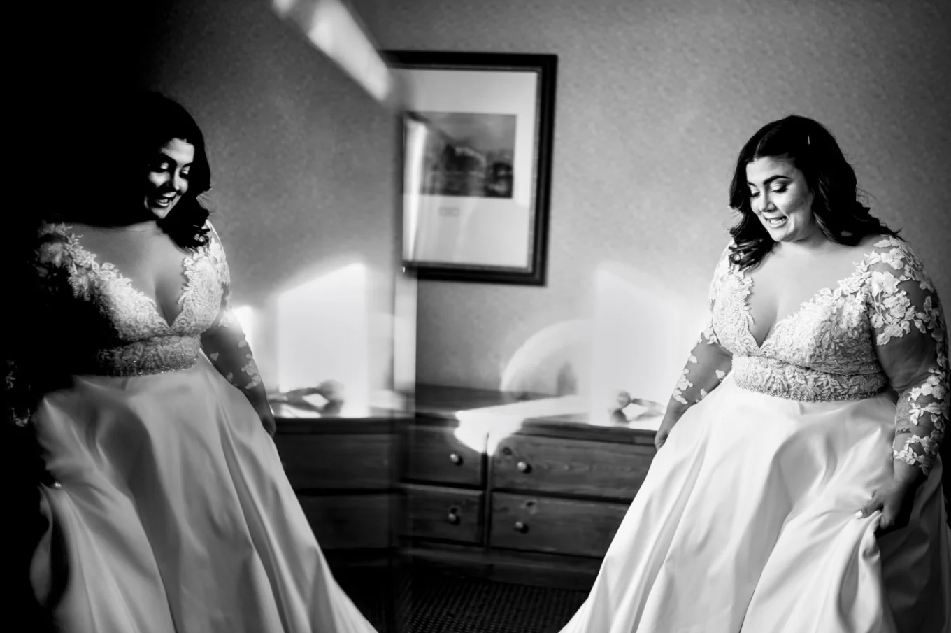 Bride look in the mirror to see herself in the wedding dress. Photograph taken by Banff Wedding Photographer.