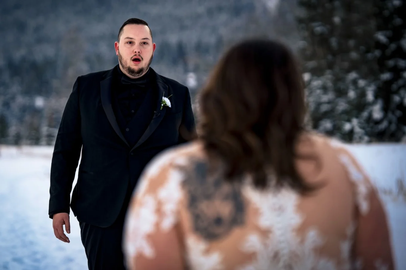 First look of bride and groom before Banff Wedding Ceremony. Groom is fascinated by beautiful bride.