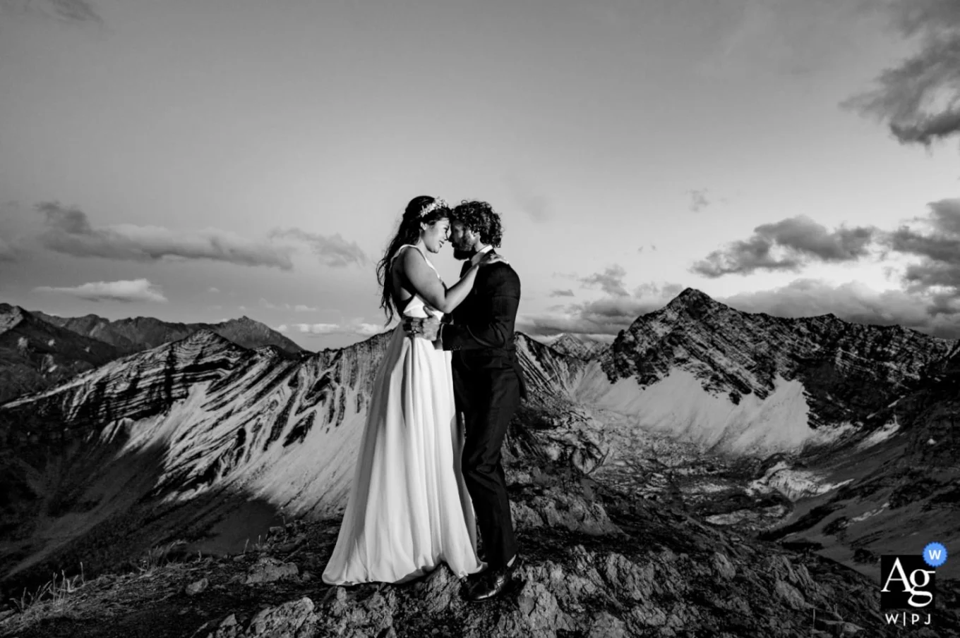 BW Banff Wedding Photography of couple on the top of the mountain looking deeply into each others eyes.