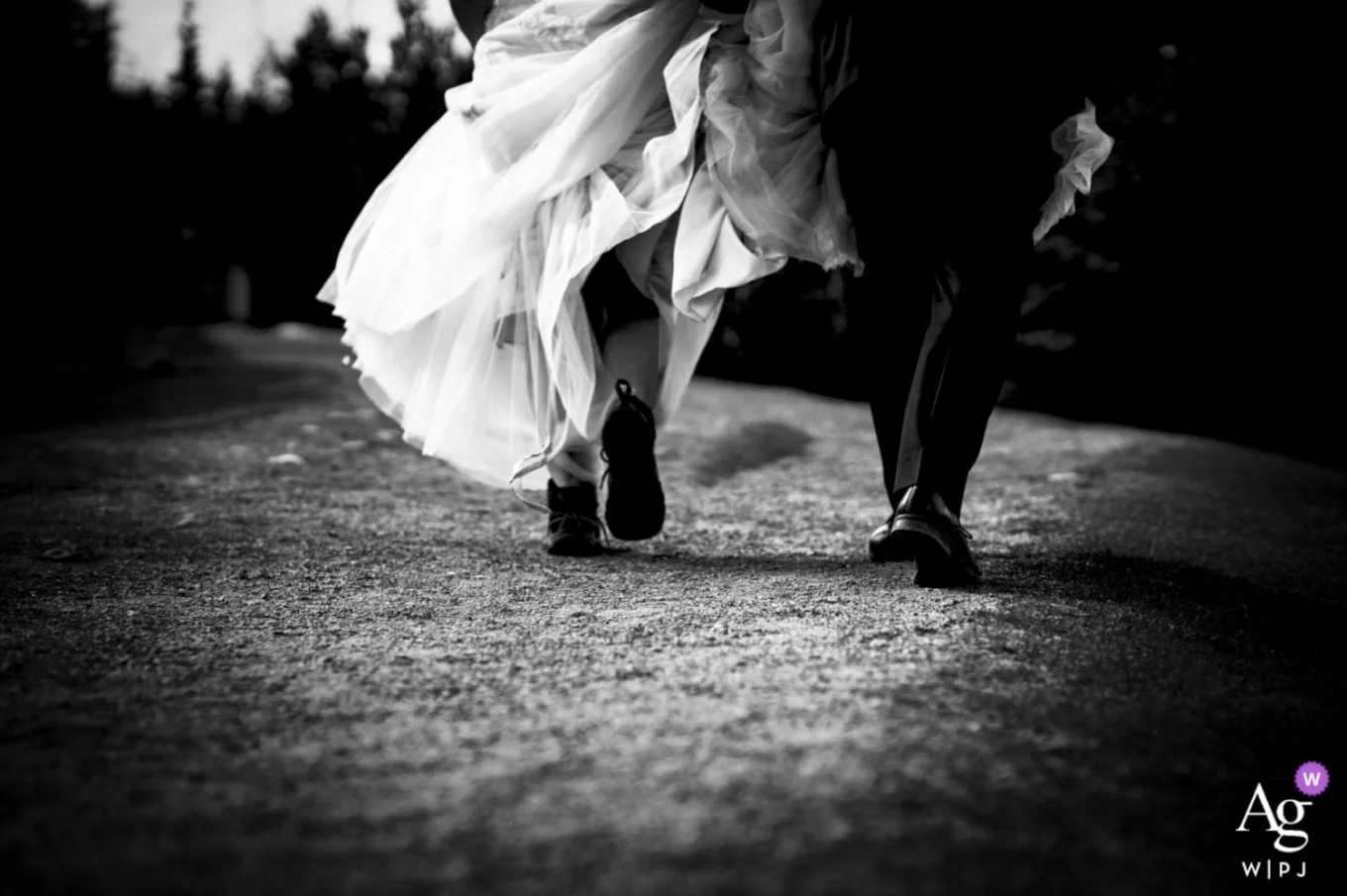 Bride and groom's walking with their hiking boots in Banff