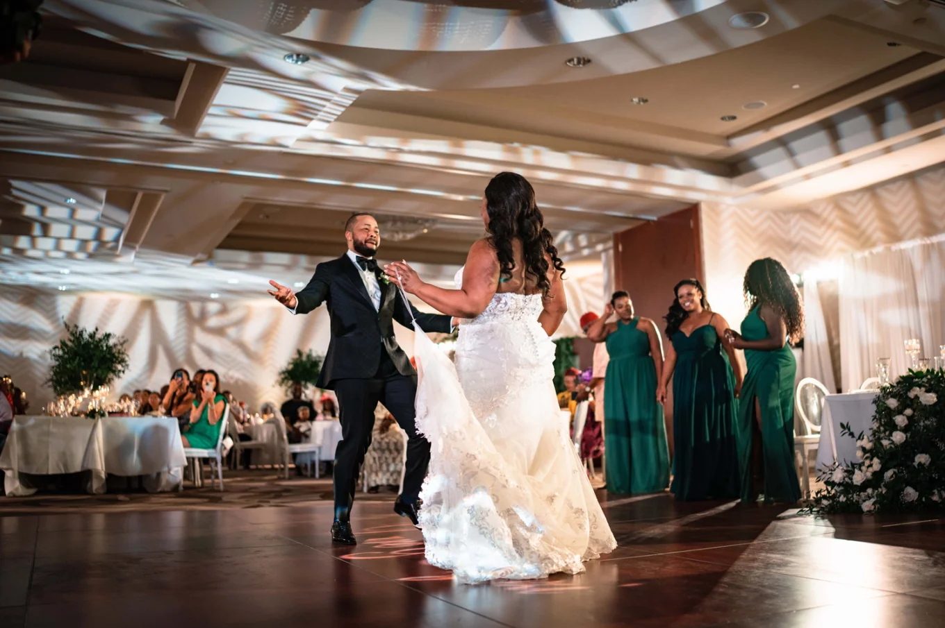 First dace at the Nigerian wedding in Calgary. Newlyweds dance at the dance floor while all the quest adore them.