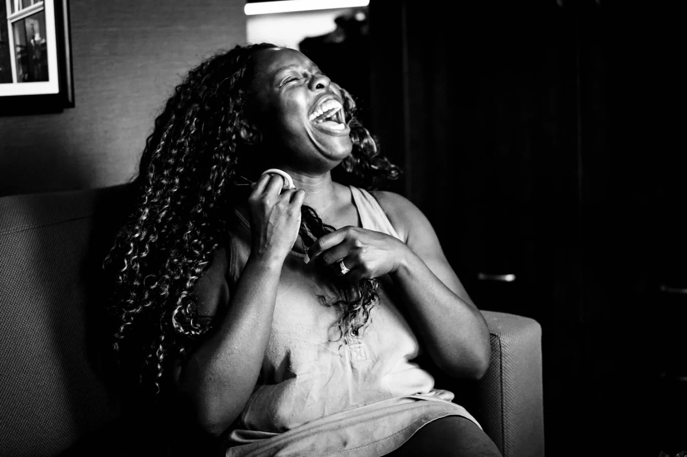 One of the bridesmaids laugh strongly.