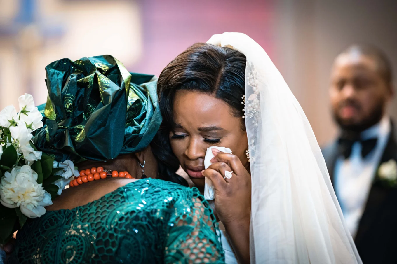 The bride cries while hugging her mother at the Calgary Wedding Ceremony.