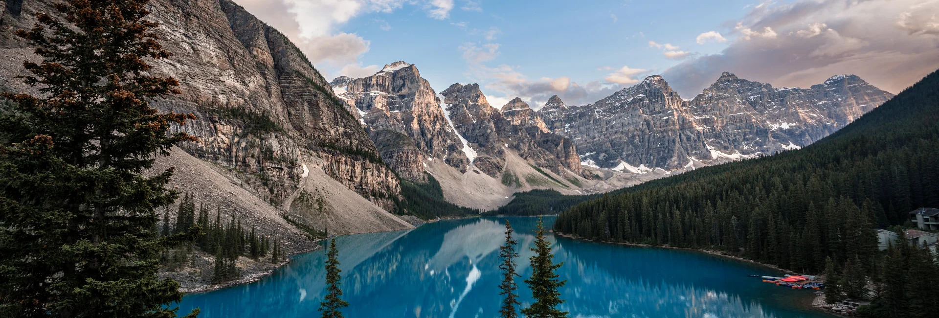 Engaged Couple standing at the shore of the Moraine Lake