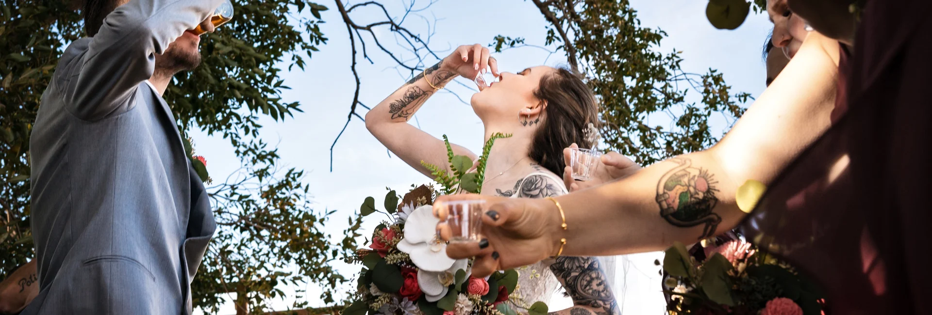 Bride and groom drink shots