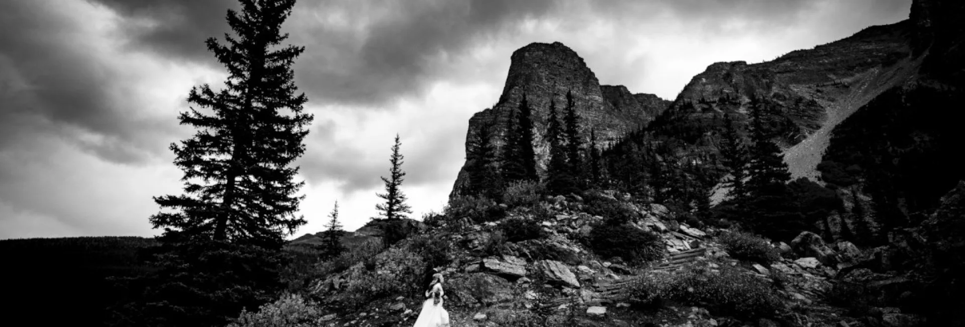 bride climbs the mountain in Banff National Park.