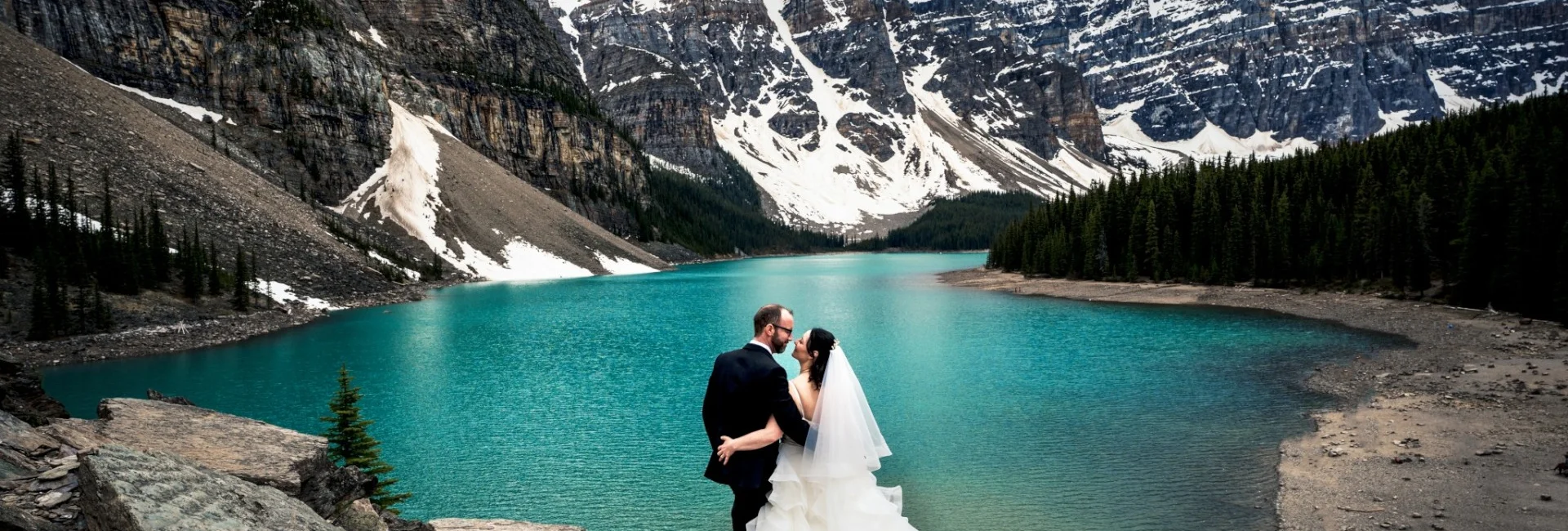Married couple adore unique view of Moraine Lake and Canadian Mountains