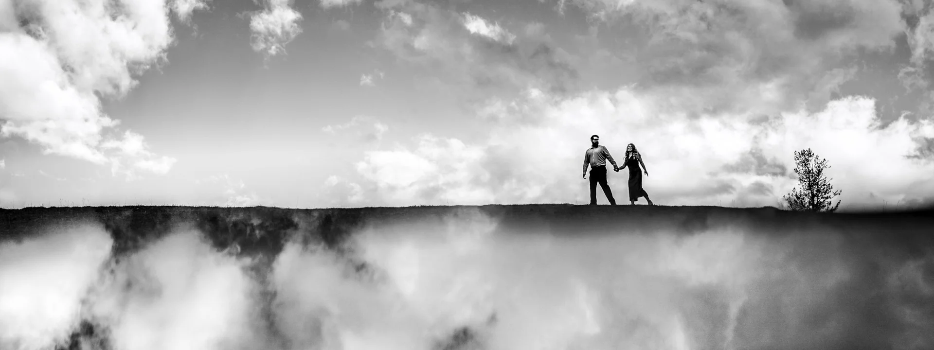 Couple hold hands during engagement session with Banff wedding photographers | 4Eyes Photography | 4Eyes Photography