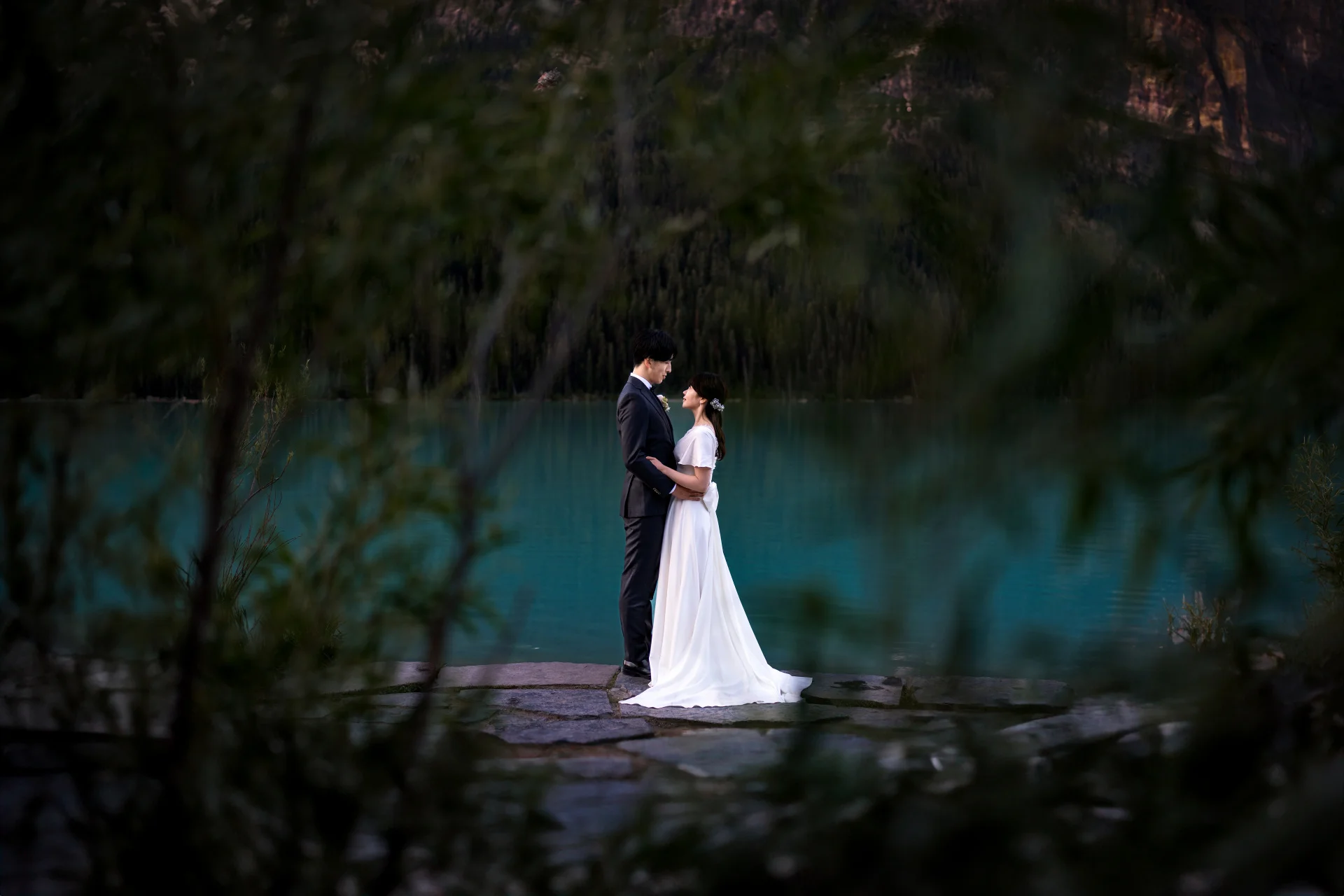 Wedding Portrait through the bushes at Lake Louise