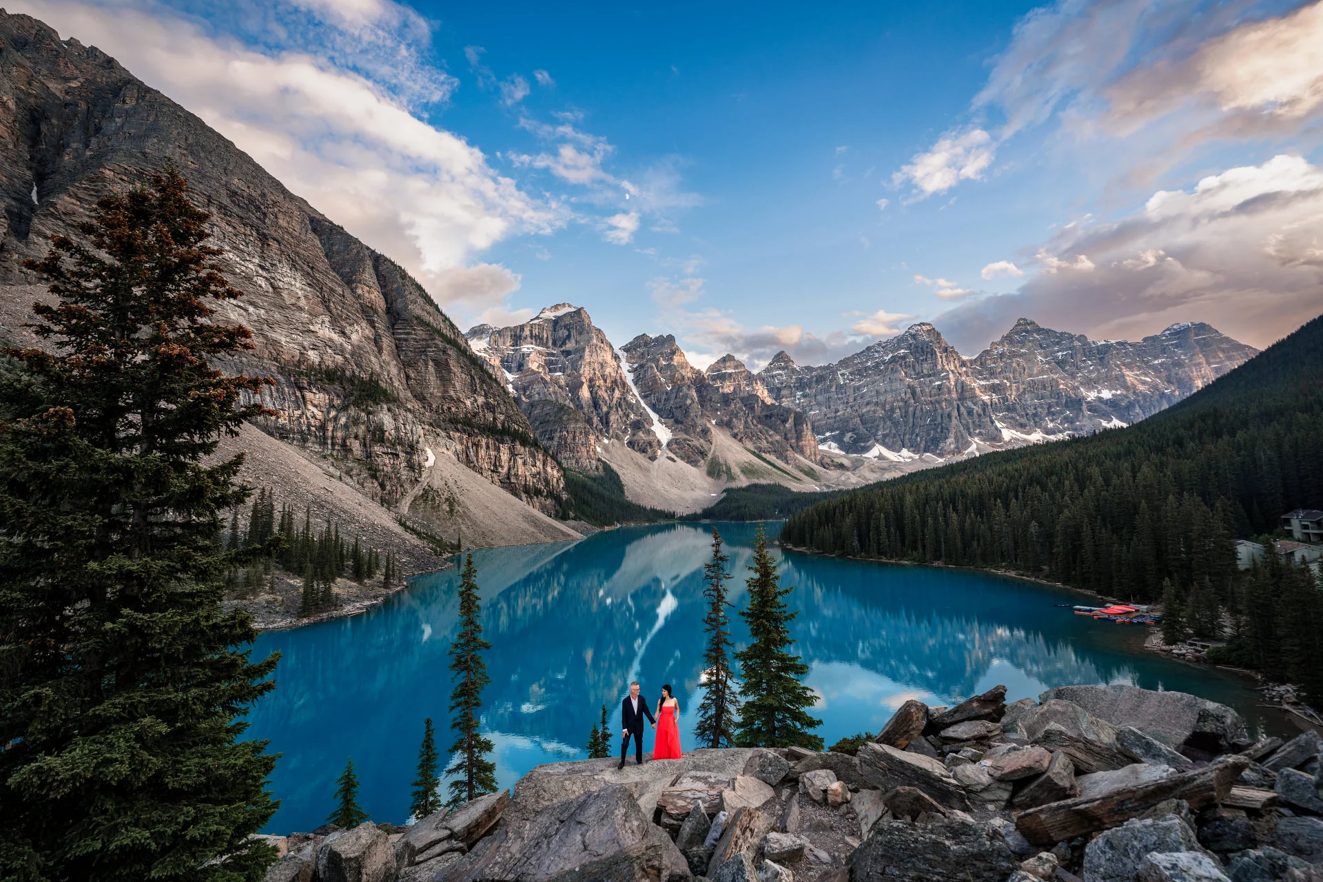 Engaged Couple standing at the shore of the Moraine Lake