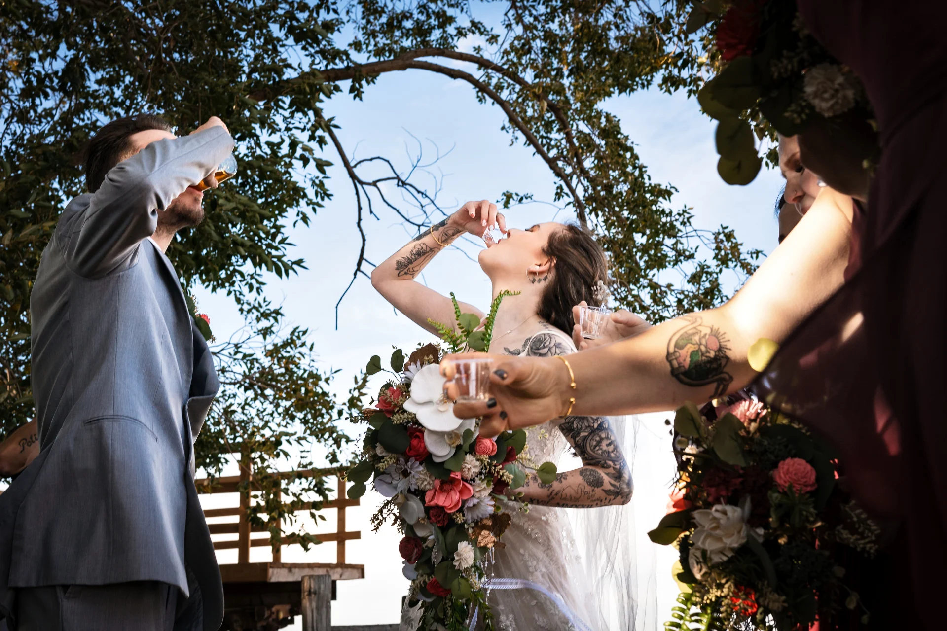 Bride and groom drink shots