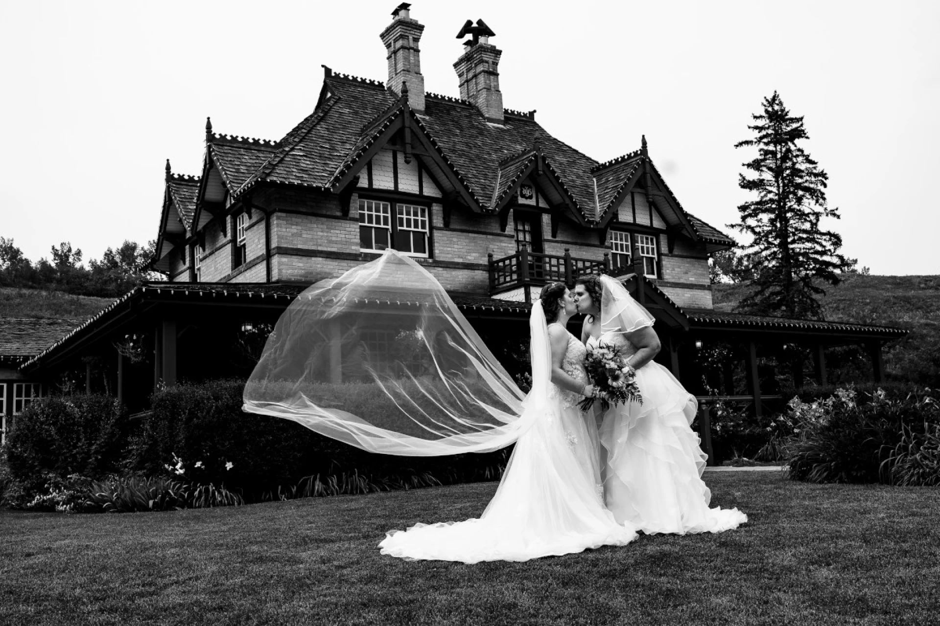 Same sex coupe kissing during their Calgary Wedding