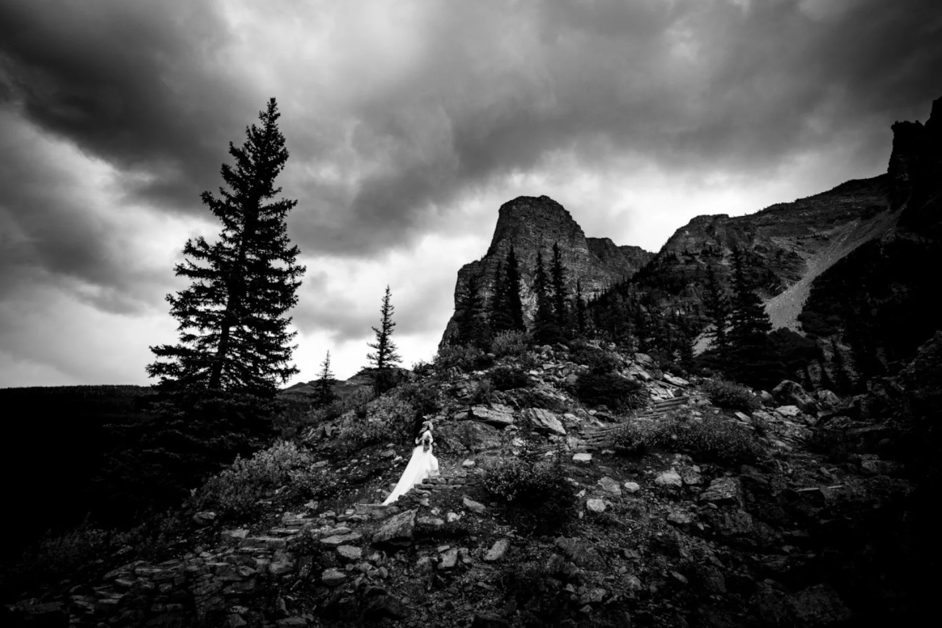 bride climbs the mountain in Banff National Park.