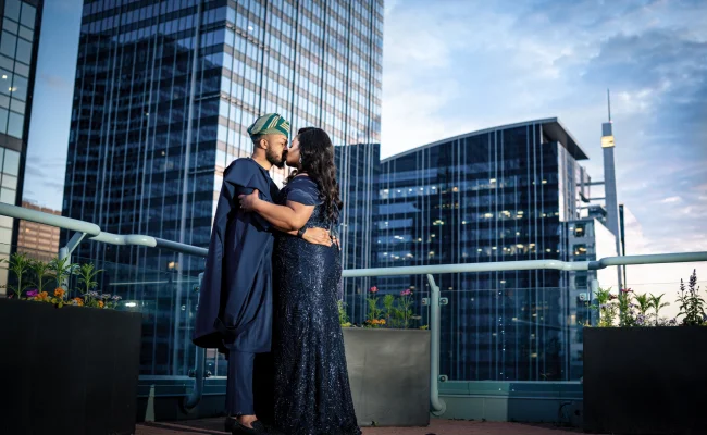 Newlyweds share a kiss on the Sheraton's balcony in Calgary.