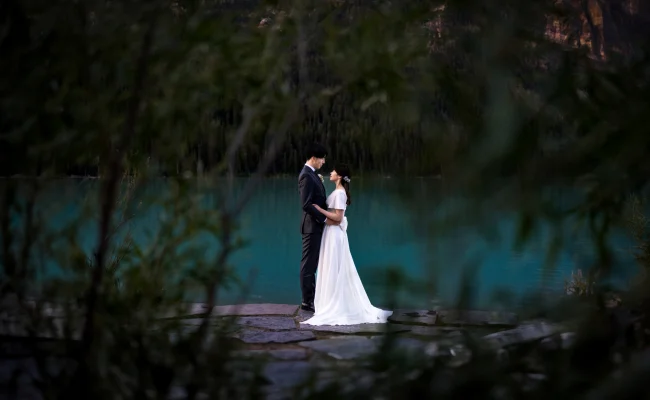 Wedding Portrait through the bushes at Lake Louise