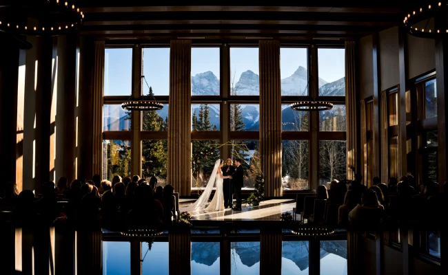 Canmore Wedding Ceremony in the Malcom Horel with the stunning view of the Rocku Mountains.