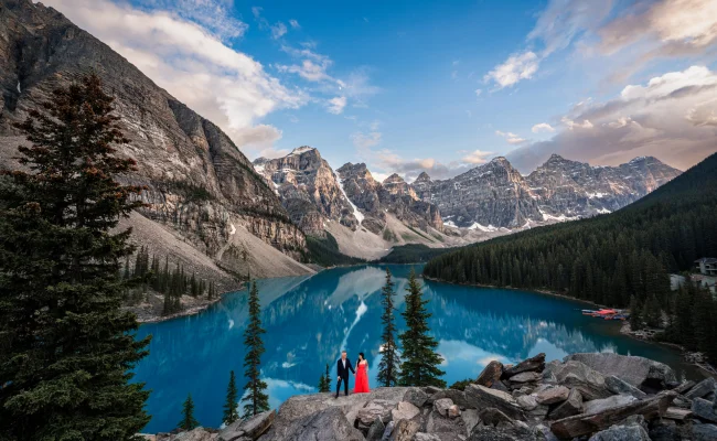 Engaged Couple standing at the shore of the Moraine Lake