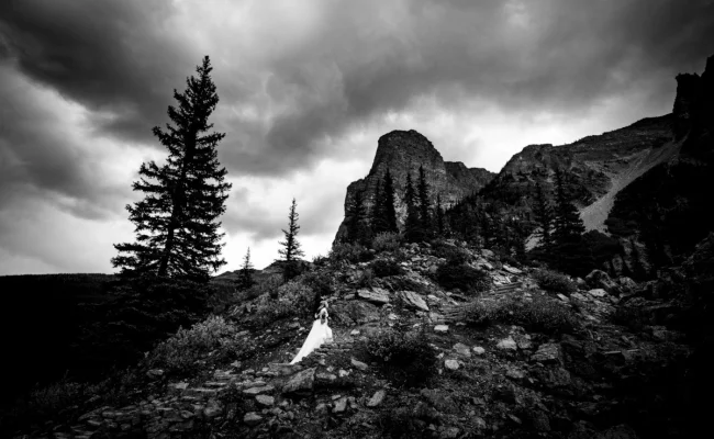 bride climbs the mountain in Banff National Park.