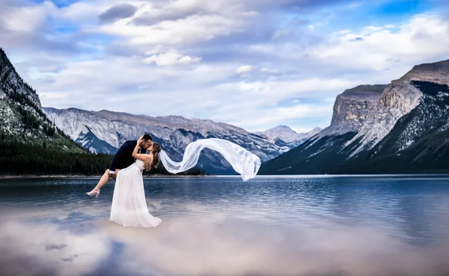 Married couple dance at Minnewanka Lake