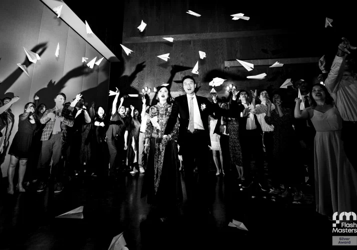 Bride and groom walking off the reception
