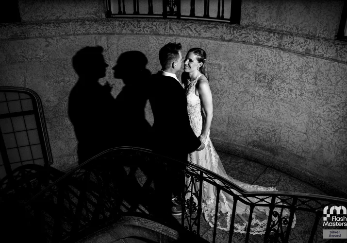 Newlyweds on the stairs in Fairmont hotel in Banff