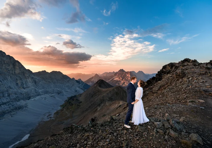 Bride and groom portrait on the top of the mountain