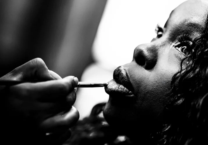 Creative photograph of the bride getting make up before the wedding in Calgary.