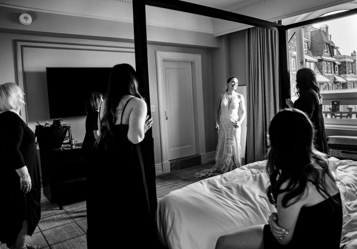 First look of the bride and bridesmaids at Fairmont Hotel room in Banff.