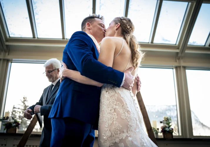 First kiss of the bride and groom.