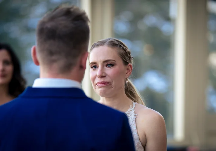 The bride cries at the Banff wedding ceremony.
