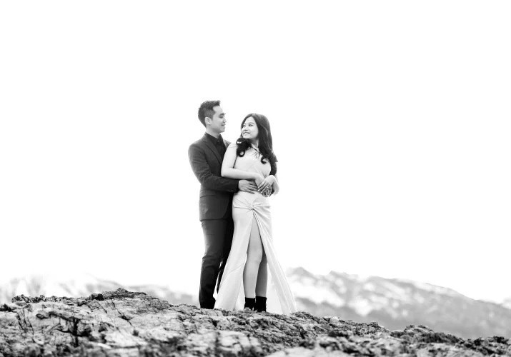 Photograph in black and white of the couple in love in a hug, looking at each other taken by Banff Wedding Photographer.