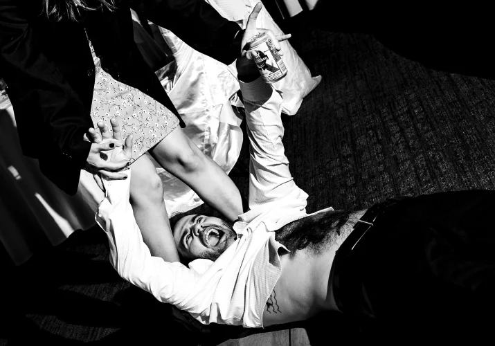 Wedding guest on the floor screaming as he can see his wife panties from that perspective.