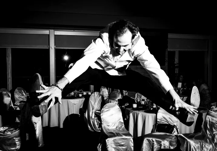 Wedding guest jumps and touches his feet on the Calgary Reception.