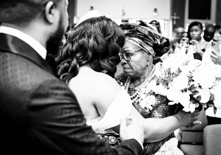 Mother and daughter in a hug before a wedding ceremony in Calgary.