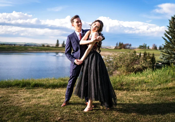 Bride and groom dance at the lake in Calgary.