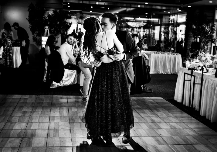Bride and groom share a kiss after the first dane