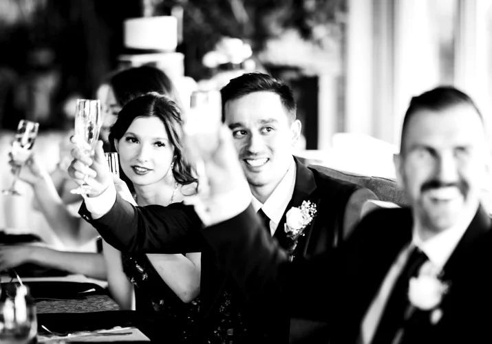 Bride and groom rise the glassed at the Calgary Wedding Reception.