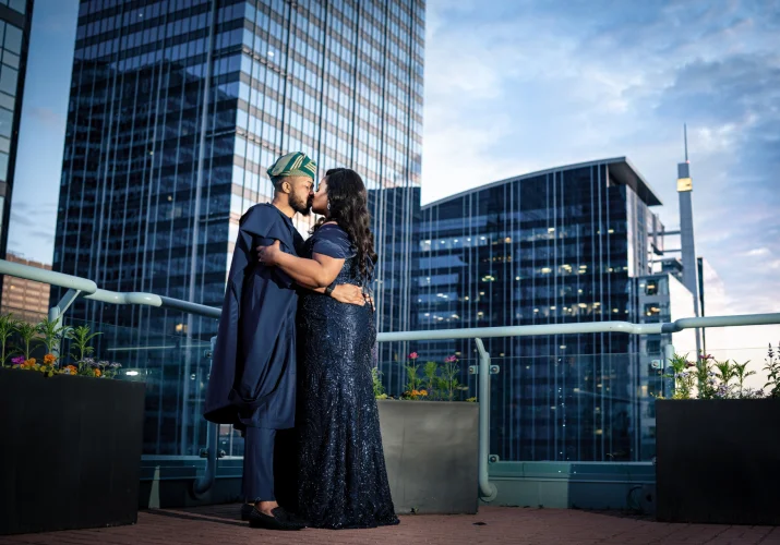 Newlyweds share a kiss on the Sheraton's balcony in Calgary.
