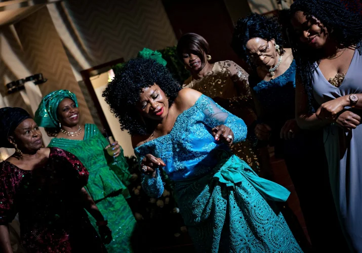 Nigerian ladies in a traditional Nigerian dresses dance at the Calgary Wedding in Sheraton.