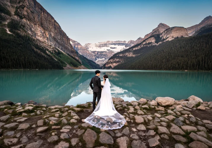 Wedding Portrait of the bride and groom from behind in the Canadian Rockies.