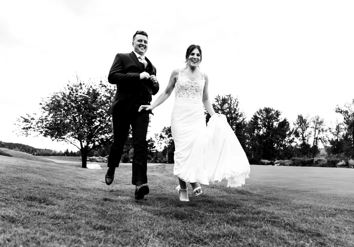 Bride and groom run away from the wedding reception in Calgary.