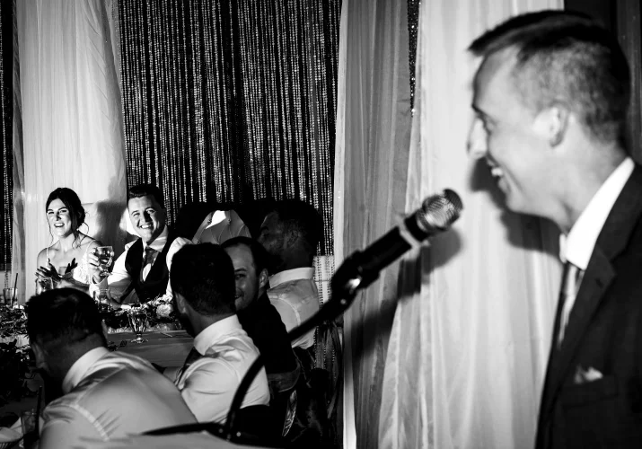 Fantastic photography in black and white of groomsman giving the speech.