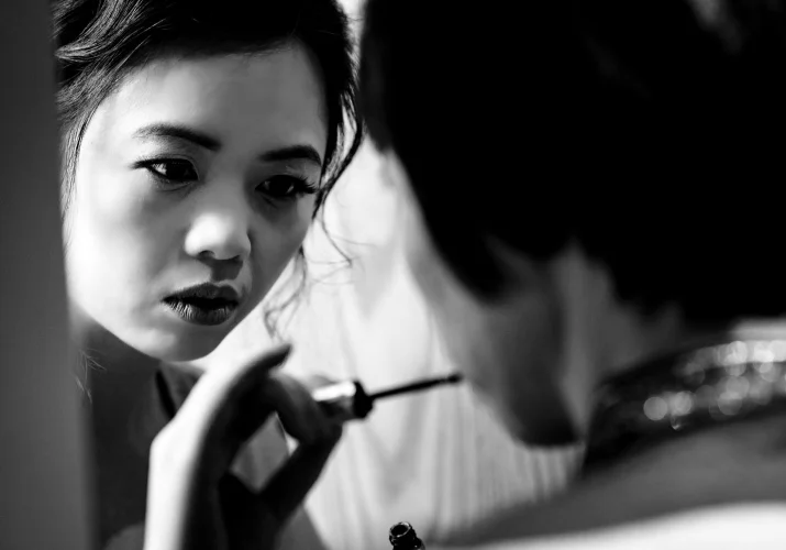 bride applies a lipstick on her mothers lips before banff wedding ceremony