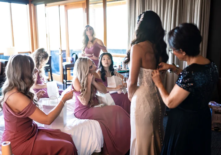 Bride and braid's maids get ready in the hotel room in Calgary