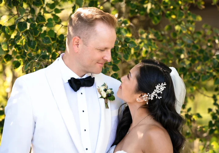 Bride and groom look at each other at the Calgary Wedding