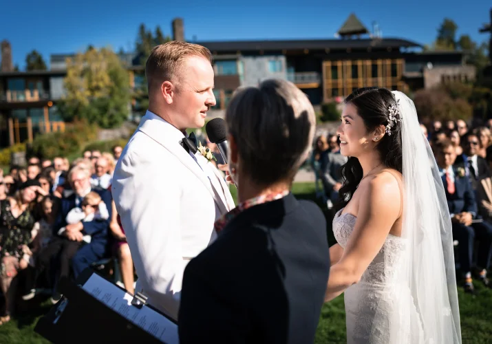 Calgary Wedding Photography of the bride and groom looking at each other during ceremony