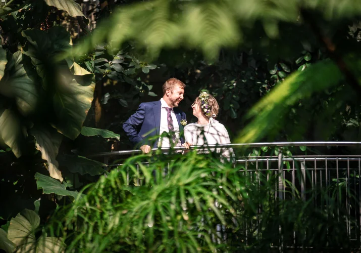 Shoot through the exotic plants of the bride and groom at the Calgary Zoo Wedding