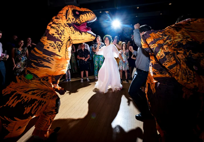 Fun Calgary dance-floor of the bride dancing whit dinosaur at the Calgary Zoo